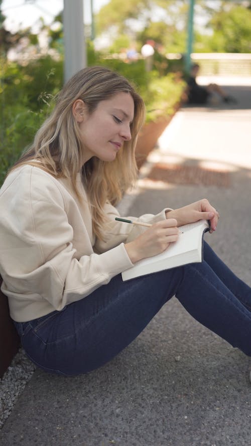 A Woman Writing in Her Notebook 