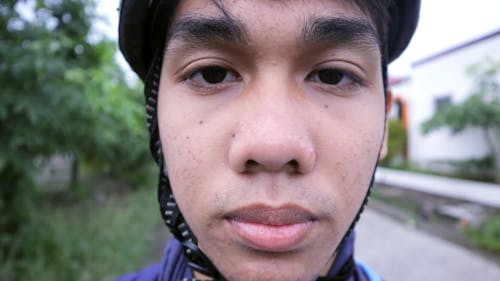 A Young Man Preparing to Go Biking 