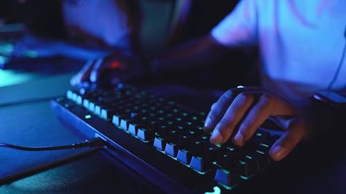 Person Typing in a Keyboard