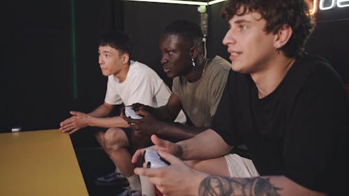 Men Competing Over Video Games