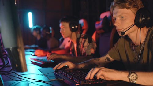 A Man Wearing Headset while Playing Computer Games