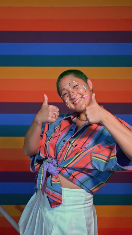 A Woman With Stickers on Her Face Doing Thumbs Up