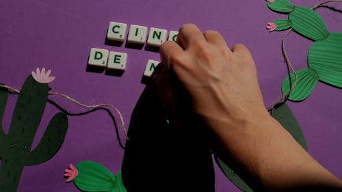Scrabble Tiles on Purple Background