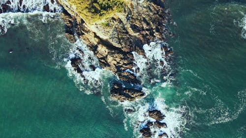 Aerial Footage of Waves Crashing on Rocks