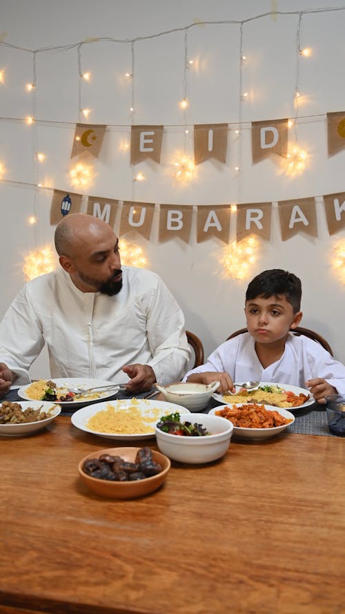 Father and Son Eating Together