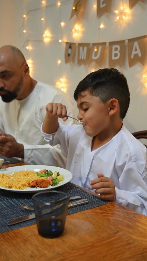 Father and Son Eating Together