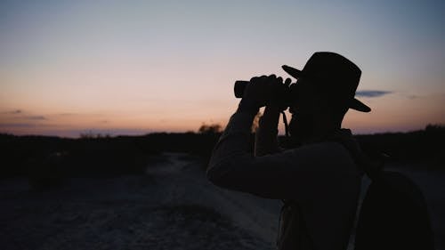 A Man Using Binoculars