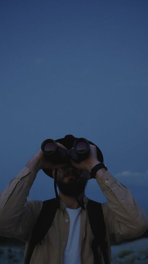 Man using Binocular Telescope