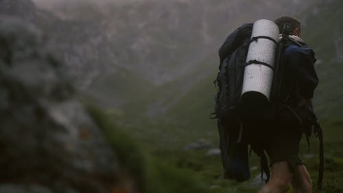 A Person Hiking in Mountain