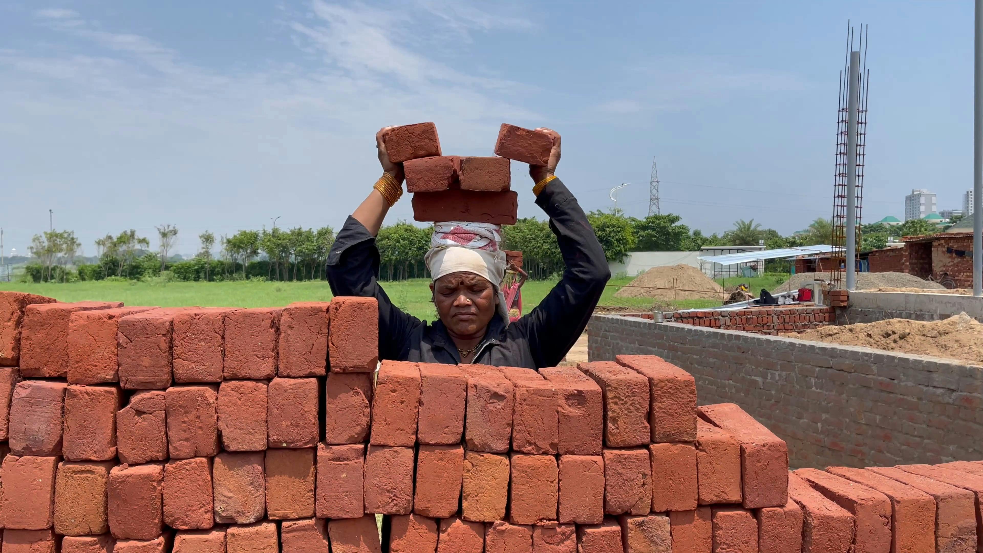 Woman Stacking Bricks on Her Head · Free Stock Video