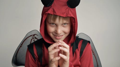 A Boy Wearing a Devil Costume