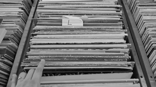 A Person Browsing Vinyl Records 