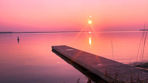 A Wooden Dock During Sunset