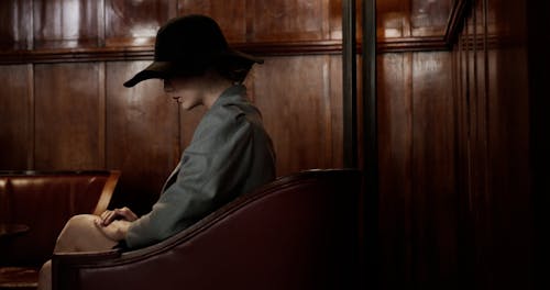 Video of a Woman Sitting wearing Hat