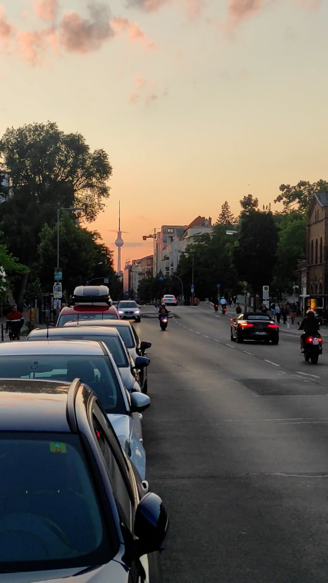 A street with cars parked on it at sunset Free Stock Video Footage ...