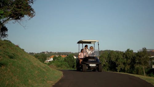Man Driving a Golf Cart