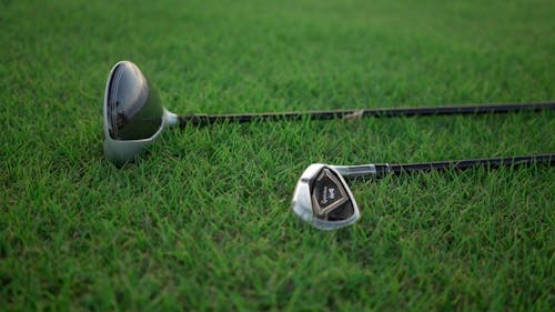 Close up of Golf Clubs on the Grass