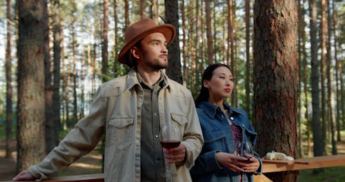 A Couple Holding their Wine Glasses