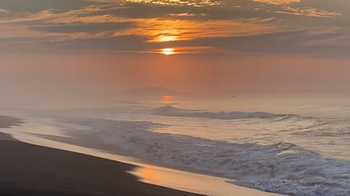 Waves During Sunrise in the Beach