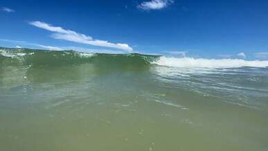 a view of the ocean from a beach