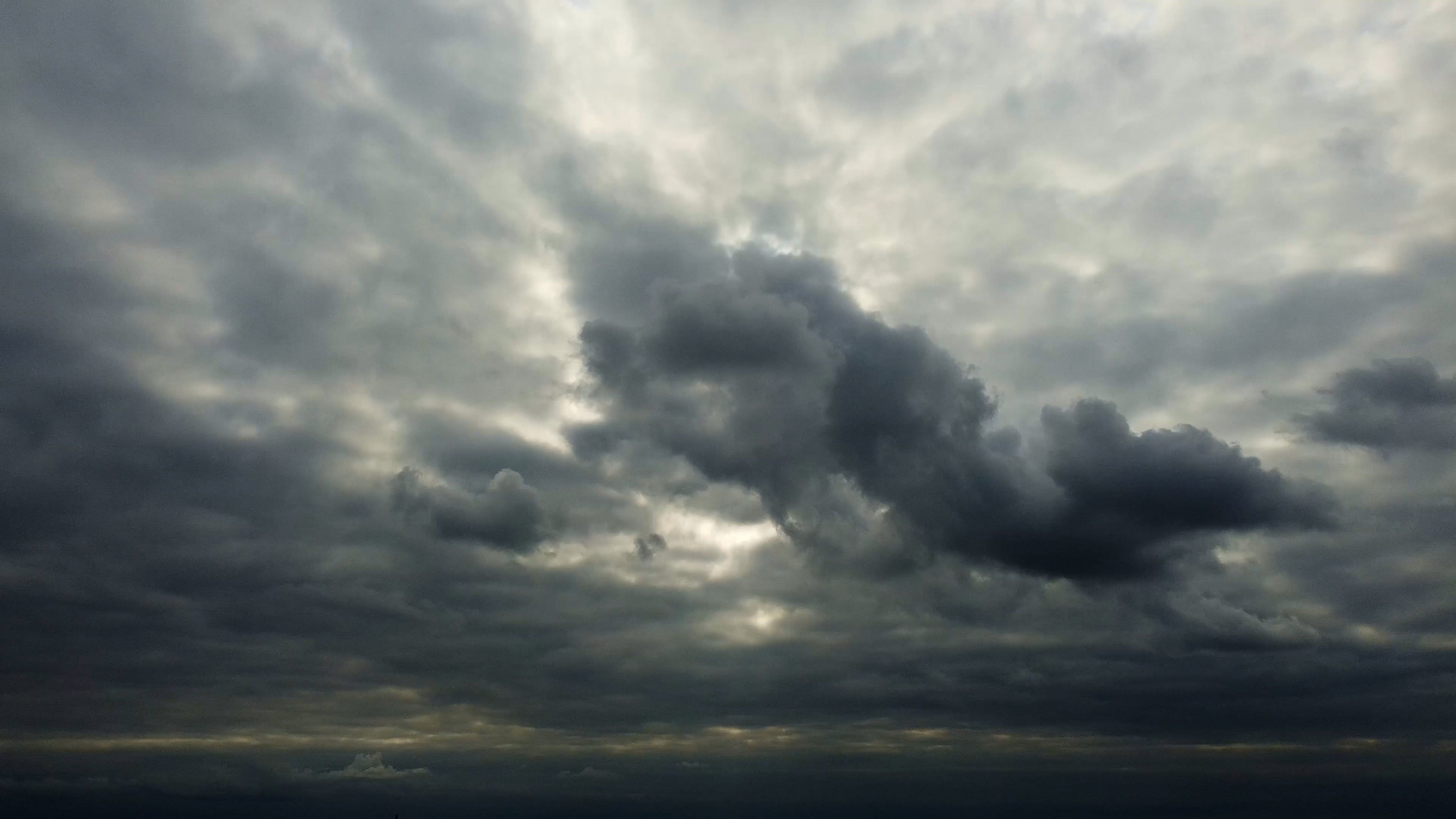 a cloudy sky over a city with buildings 9259022