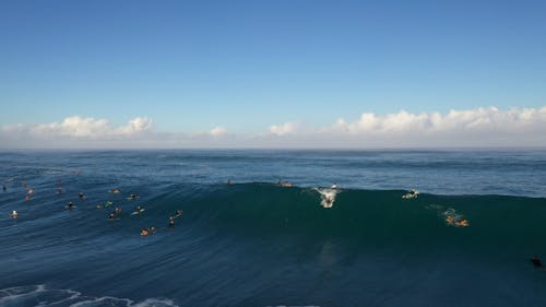 Drone Footage of a Surfer Surfing a Wave