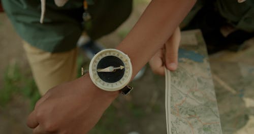 A Scout Twisting His Compass