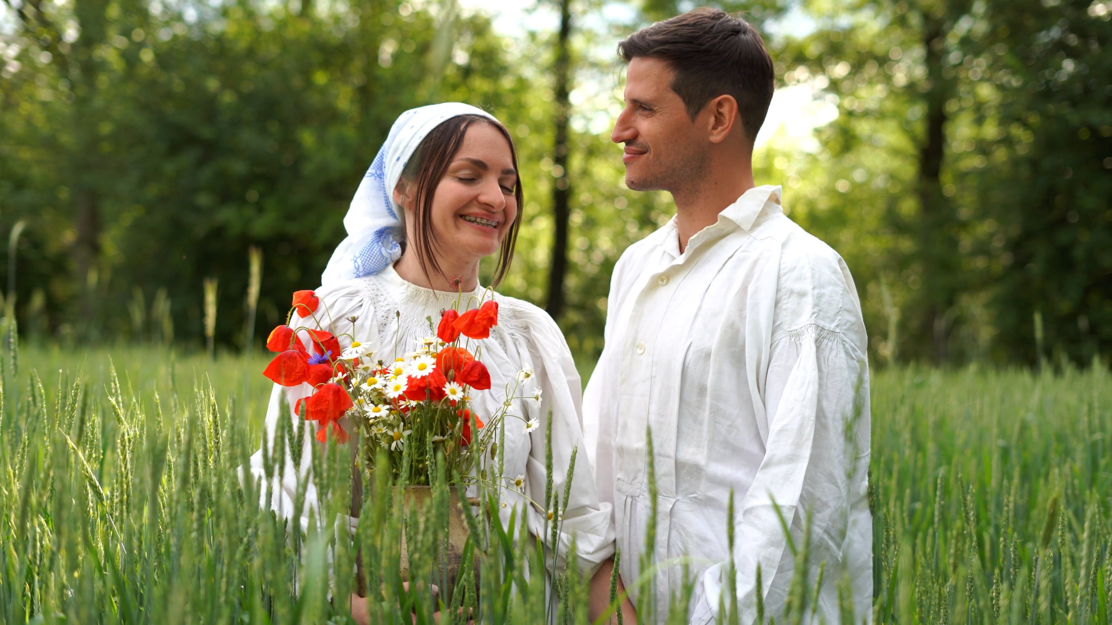 A man and woman kissing in a field of flowers Free Stock Video Footage ...