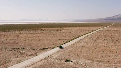 Aerial Shot of a Car on a Desert Road