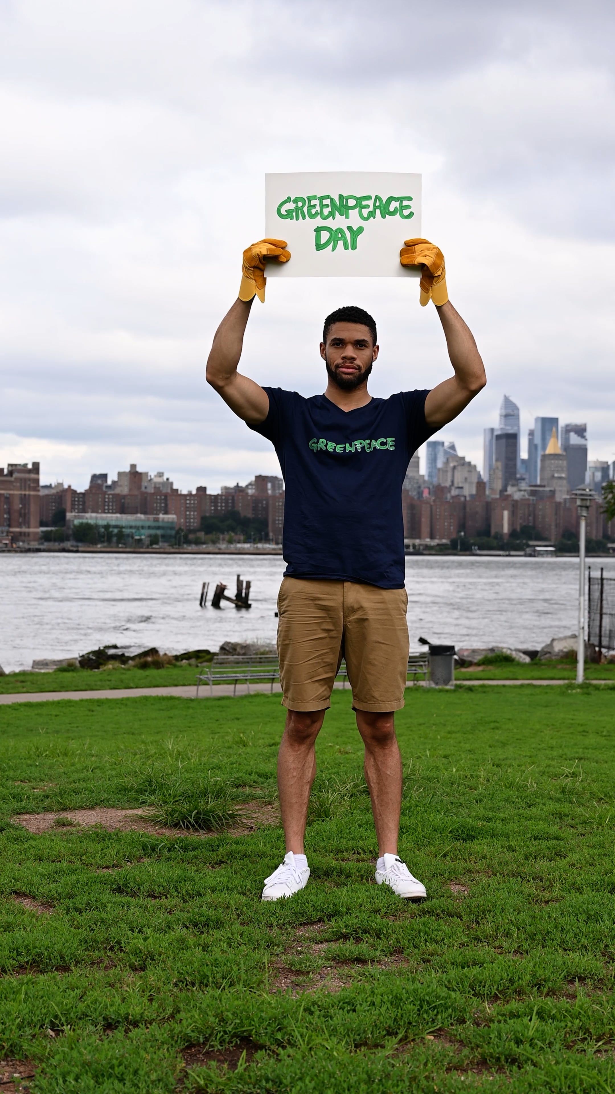 A man holding up a sign in front of the city Free Stock Video Footage ...