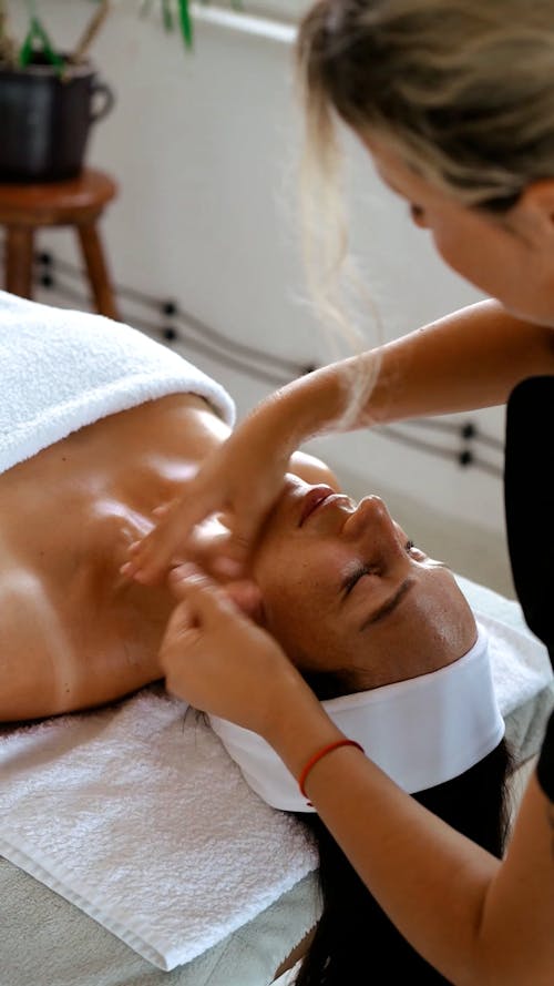 A Woman Getting a Face Massage