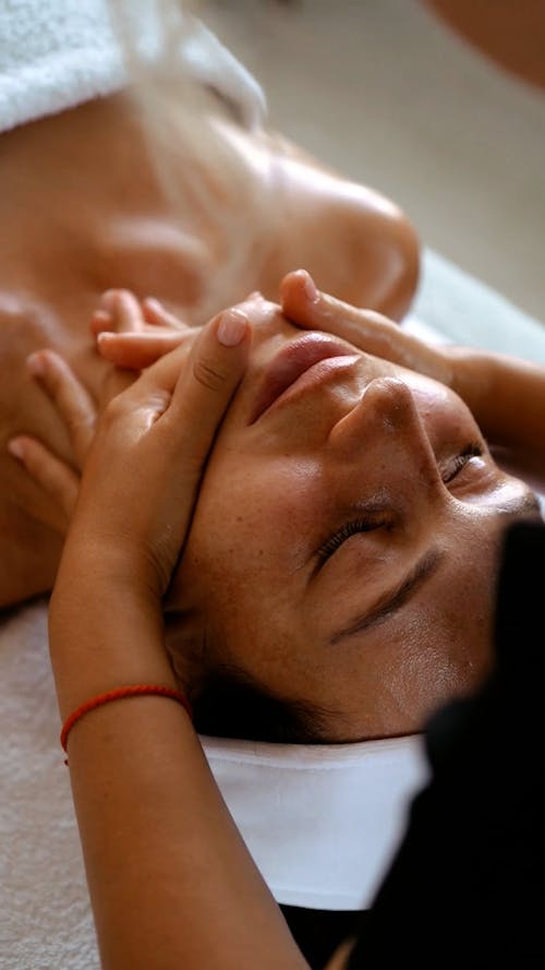 A Woman Having a Face Massage