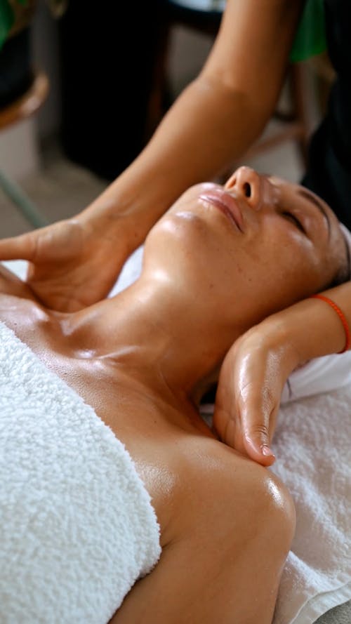 A Woman Having a Face Massage