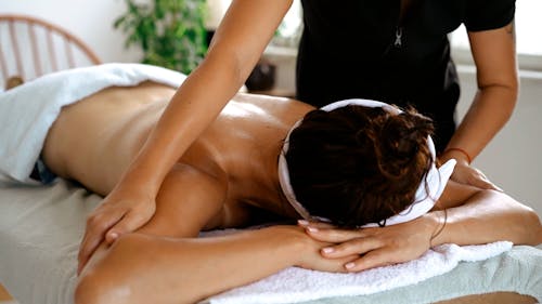 A Therapist Massaging a Client