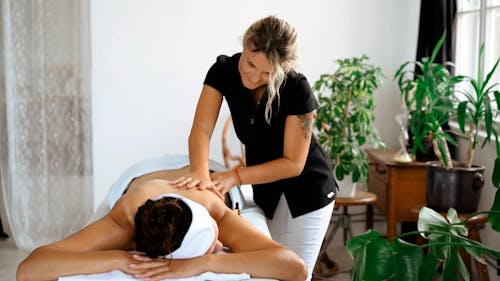 A Client Having a Back Massage