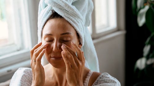 A Woman Massaging Her Face