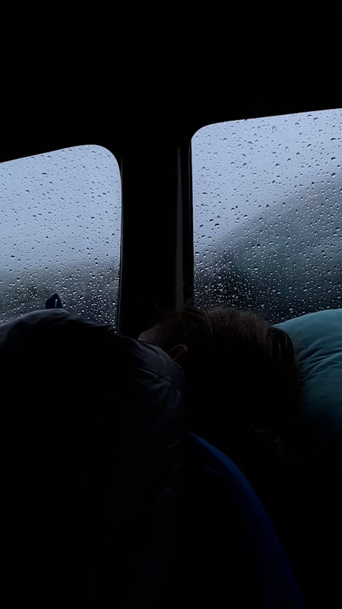 A Person Sleeping in a Car