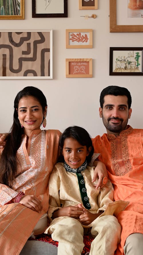 A Family Sitting on the Couch