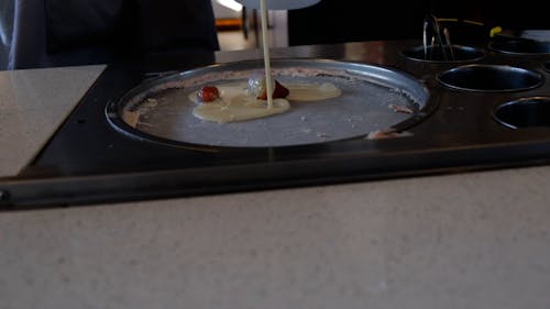 Person Making Strawberry Ice Cream