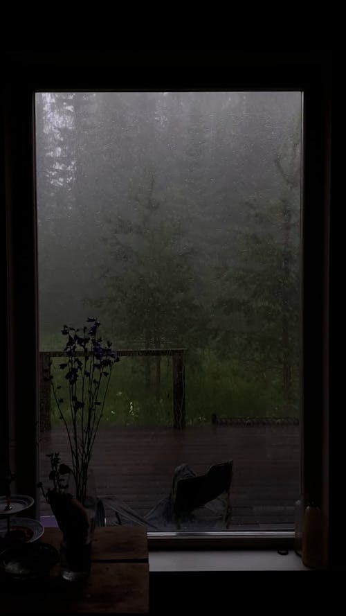 A Glass Window with Raining View Outside