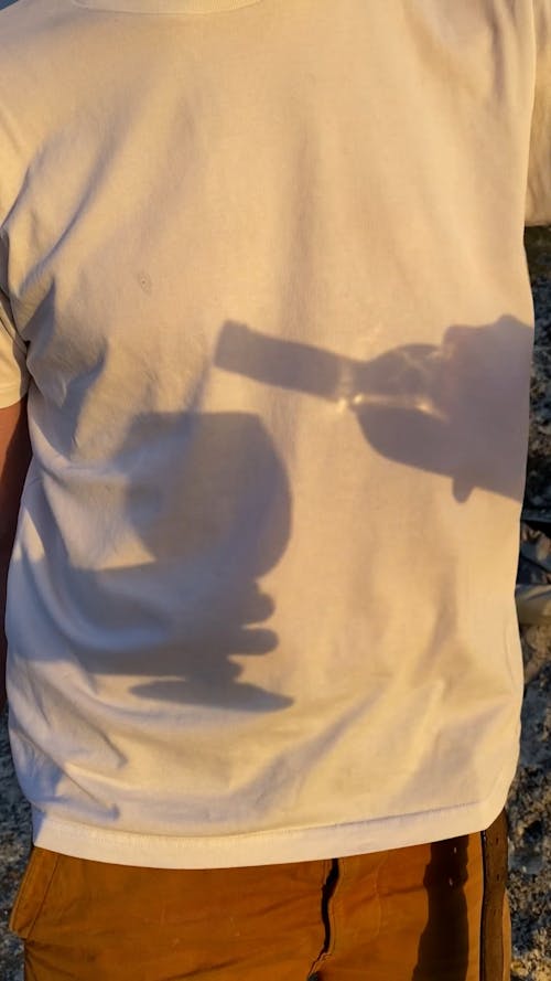 Shadow of a Man Pouring Wine in a Glass 