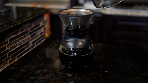 Person Making Drip Coffee