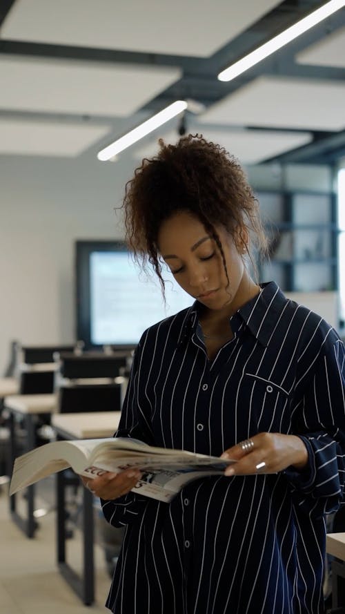 A Woman Reading an Economics Book
