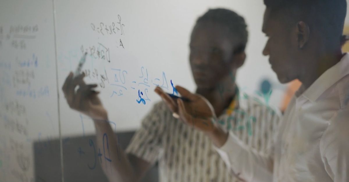 Guy Solving Math Problem Footage of Men Solving Number Problems on a Board Free Stock Video ...