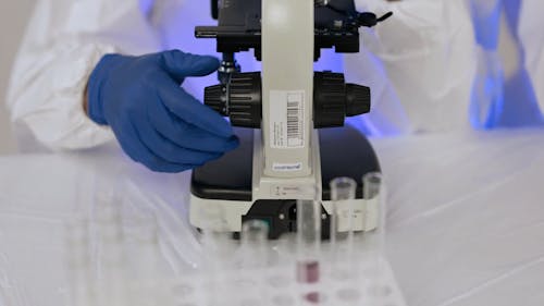 A Chemist Using a Microscope