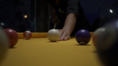 Close-up Footage of a Person Playing Billiards