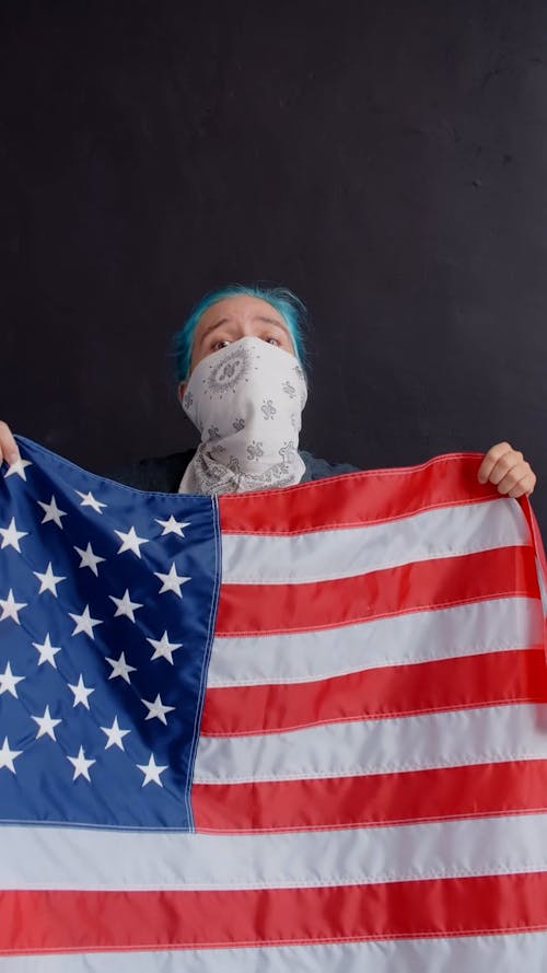 A Person Holding the American Flag
