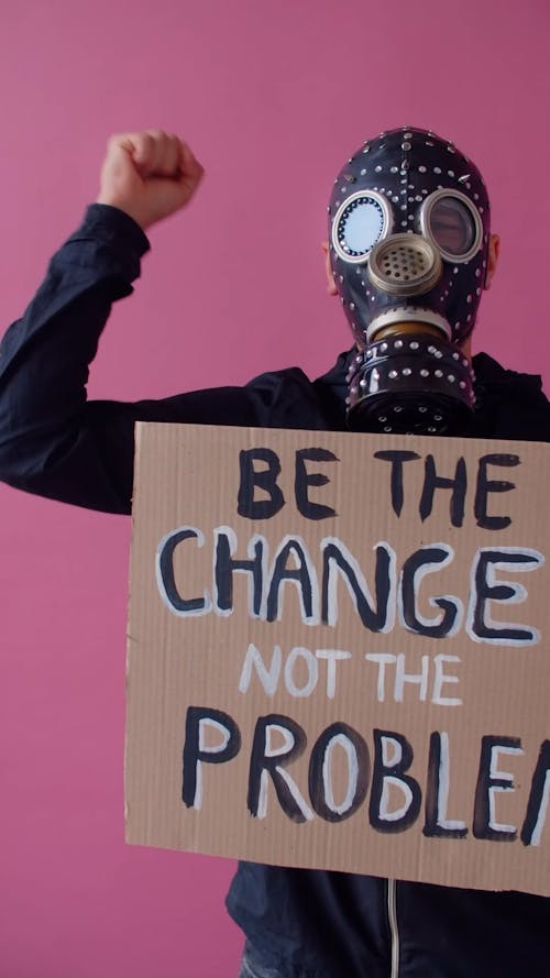 A Person Protesting while Holding a Placard