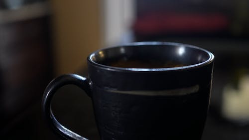 Close up of Coffee being Poured into a Cup