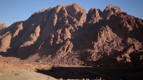 A Group of People Walking in the Valley of Mount Sinai